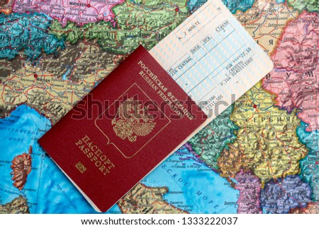Preparing for the trip, travel. On the map is a passport and ticket