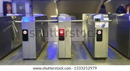 Automatic barriers for control people entered in railway station or in metro, red and green light, necessary tickets, new technologies in habitual life, automatic open and close doors