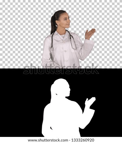 Young medical doctor woman presenting and showing product or text, Alpha Channel
