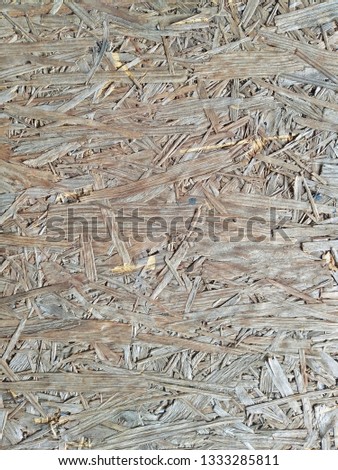 Plywood texture and background , Compressed light brown wooden texture, Surface of the pressed wood plate made of the remains of processing of a tree

