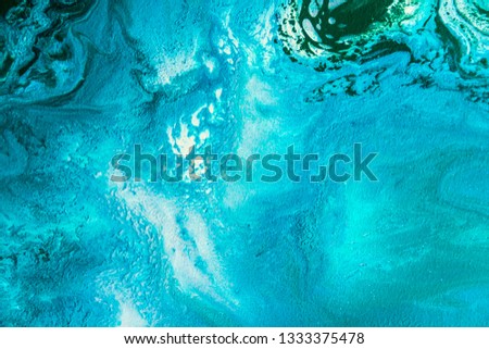 Abstract painting drawn by fluid acrylic technique. Picture with emerald, green, mint colorful water stains, gradients on blue background. Imitation of sea ocean waves on canvas. Modern art concept. Royalty-Free Stock Photo #1333375478
