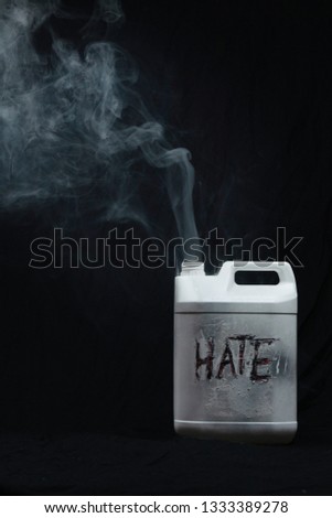Mental health interpretation of hate, a 5l container against a black background with the hate released in fume or smoke format