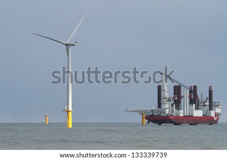 newly erected wind turbines off shore Redcar england UK Royalty-Free Stock Photo #133339739