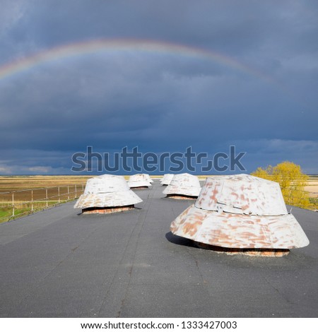 Rainbow, view from the roof of the building. Ventilation outlets on the roof of the building.