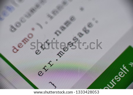Closeup image of a digital screen where coding language "Err.message" "focused" and written digitally.  
