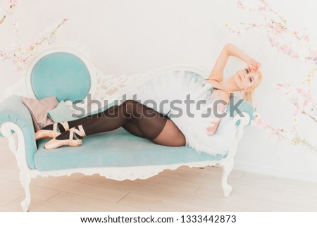 Ballerina dancer in pastel soft interior. Ballet concept