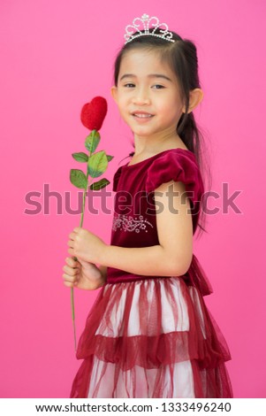 Asian child girl on pink background