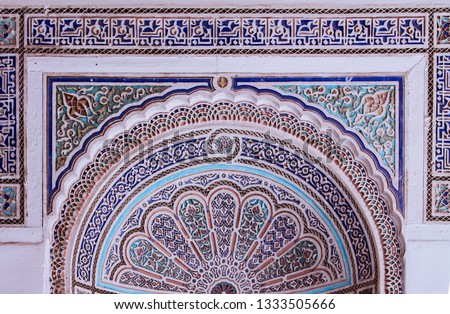Beautiful complex exquisite carving on the plastered white walls of the Bahia Palace in the southeastern part of the medina of Marrakesh. Morocco Africa
