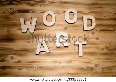 WOOD ART words made of wooden letters on wooden board.