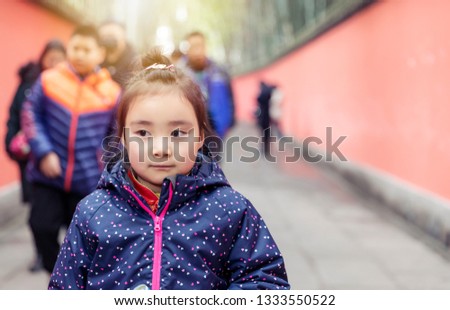 Lovely Asian girl in the red corridor