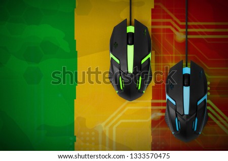 Mali flag  and two mice with backlight. Online cooperative games. Cyber sport team