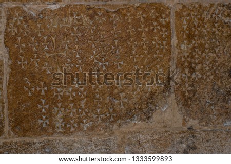Christian crosses on the stones of the Temple of the Holy Sepulcher