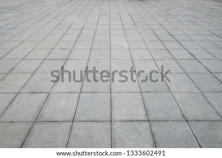 

Perspective View of Monotone Gray Brick Stone on The Ground for Street Road. Sidewalk, Driveway, Pavers, Pavement in Vintage Design Flooring Square Pattern Texture Background