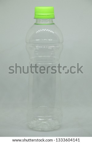 Clear plastic bottle with green lid