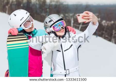 goregeous positive glamour girls making pictures of themselves, entertainmnetn, woman having a great time on winter holidays, close up photo