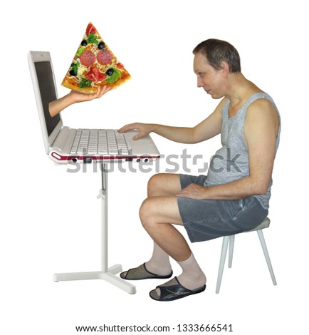 The man makes a food order on the Internet from his computer. A hand gives him a slice of pizza from laptop screen. Isolated.