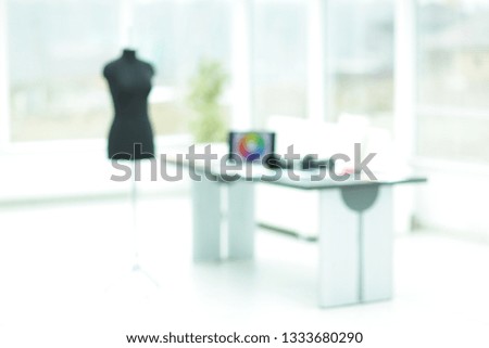 background image of the fashion Atelier . custom tailoring