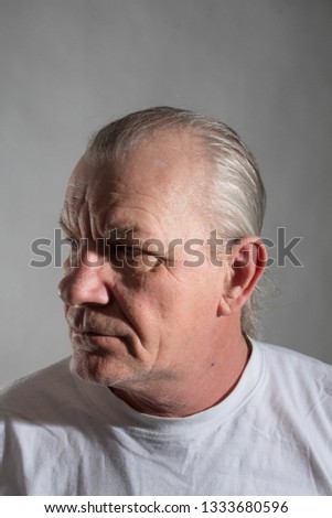 mature male, depressed and sad expression, concept, lonely, old ill. studio on grey background