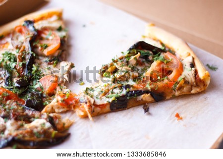 Fast food. Slices of pizza in a fast delivery box close-up.