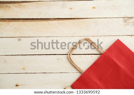 Cardboard bags on a wooden isolated background. Top view