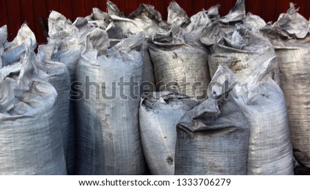 gray dirty bags are on the street