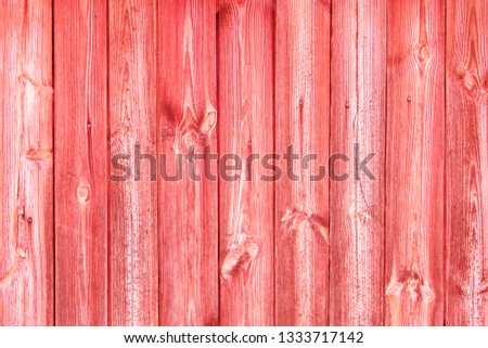 Pink coral painted wooden planks background texture.