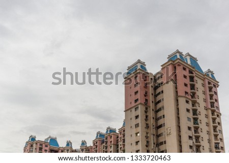Photograph indicating recent real estate development in chennai, India, with high rise unidentified residential apartments. chennai india tamilnadu