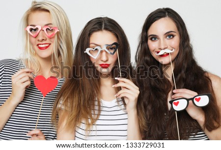 lifestyle, emotion and people concept: three girls best friends ready for party