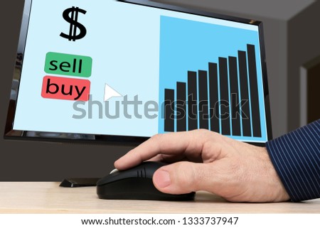 Electronic bidding. Graph of exchange rates on a computer screen. A man buys dollars.