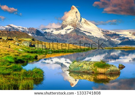 Fantastic photography and hiking location, wonderful morning lights with spectacular Matterhorn and gorgeous Stellisee lake. Beautiful touristic place in Switzerland near Zermatt, Europe Royalty-Free Stock Photo #1333741808