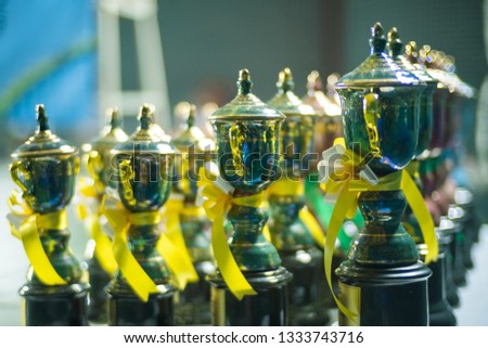 Group of colorful trophy with blurred bokeh in background.