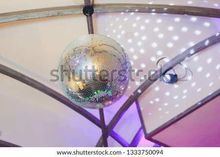Disco ball with fireworks, night party background photo.