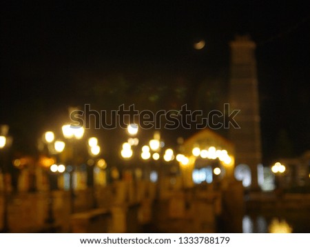blur defocused picture of vintage style tourist destination in a lonesome town at night with warm tone lighting for vintage urban homesick mood backdrop background 
