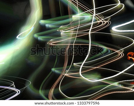 Blurred light effects. Neon glow. Night traffic. Abstract background.