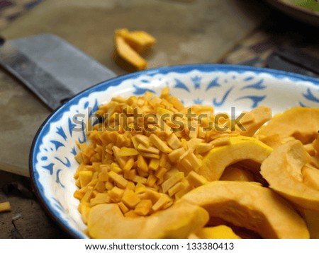 Slices of pumpkin and cutting board