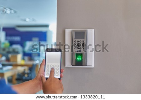 Digital door lock systems control by mobile phone for access security and protection. Man or woman user mobile for access digital door lock systems. Selective focus.