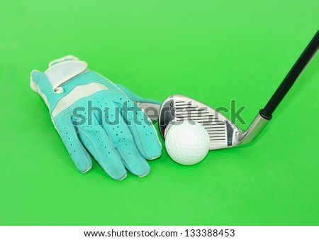 metal golf driver and glove