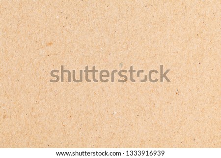 Sheet of paper brown cardboard. Texture close-up, natural rough textured paper background.