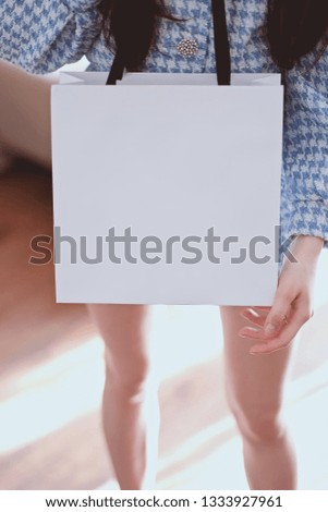 Girl in a trendy outfit with package. template 