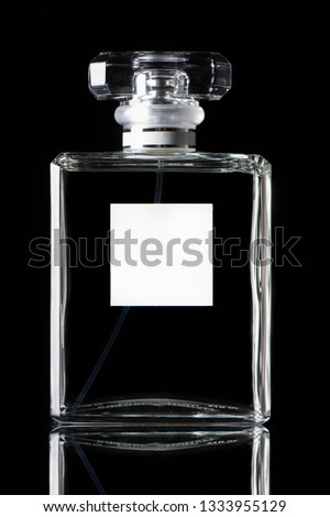 Studio shot transparent glass perfume bottle