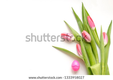 Bouquet of pink five tulips with green leaves on a white background. Beautiful flower in the spring season. Top view of empty space