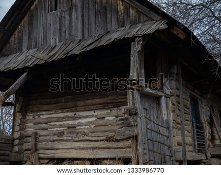 Log house. Old single house. Photo of an unusual house in the forest. Abandoned single small house in mountain