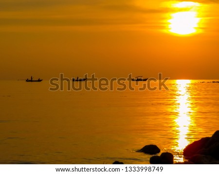 Fishermen at sunset in Ko Pha Ngan, Thailand