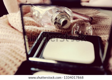 Moscow, Russia, March 2019. Reflection in the mirror. Perfume bottle, powder