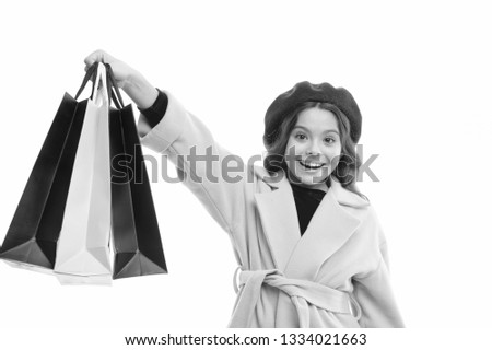 Child satisfied by shopping isolated white background. Obsessed with shopping and clothing malls. Shopaholic concept. Signs you are addicted to shopping. Kid cute little girl hold bunch shopping bags.