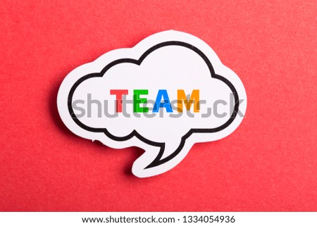 Team colorful text speech bubble isolated on red background about Teamwork concept.