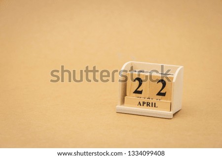 April 22 : wooden calendar on vintage wood abstract background. Earth Day using as background Universal day concept and Earth Day concept with copy space  for your text or design.