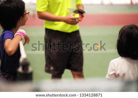 Portrait Asian girls talk to the referee in the tennis court during match tournament