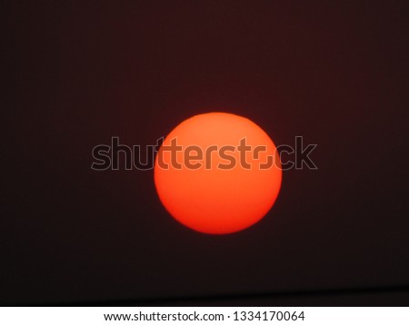 dramatic red orange colored sunset 