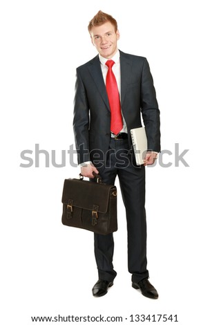Portrait of successful business man with bag and holding laptop, isolated on white background